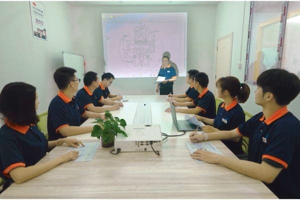 Engineer reviewing CAD designs on computer monitor