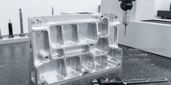 Complex aluminum aerospace structural component with multiple machined features