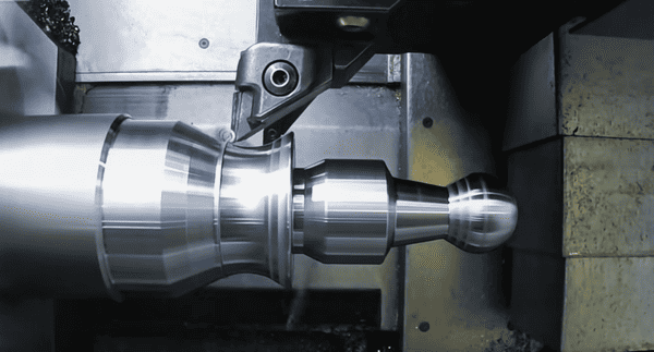 High-speed CNC turning operation showing precision machining