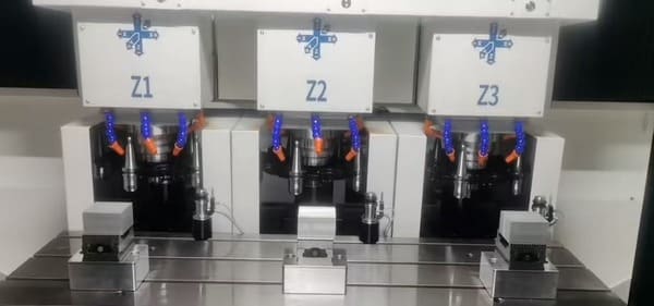 Technician using CMM coordinate measuring machine to inspect precision CNC part