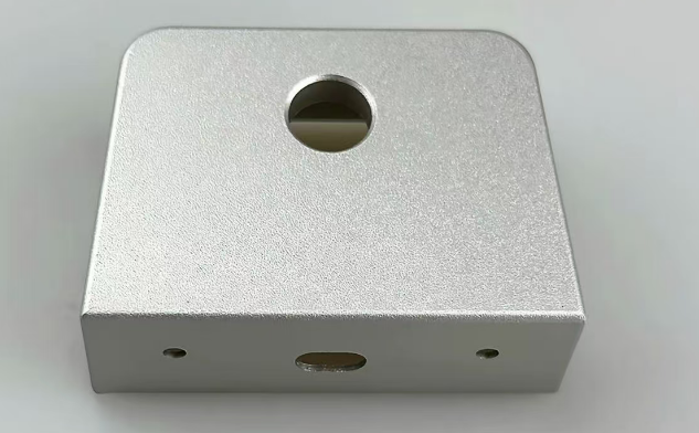 Metal surface after bead blasting showing uniform matte texture